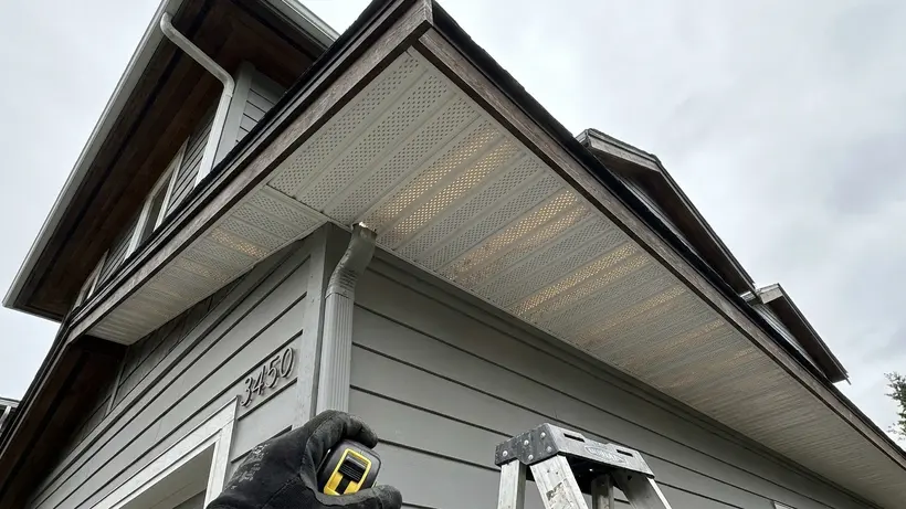 Soffit intake vents located under the eaves of a residential roof in Washington.